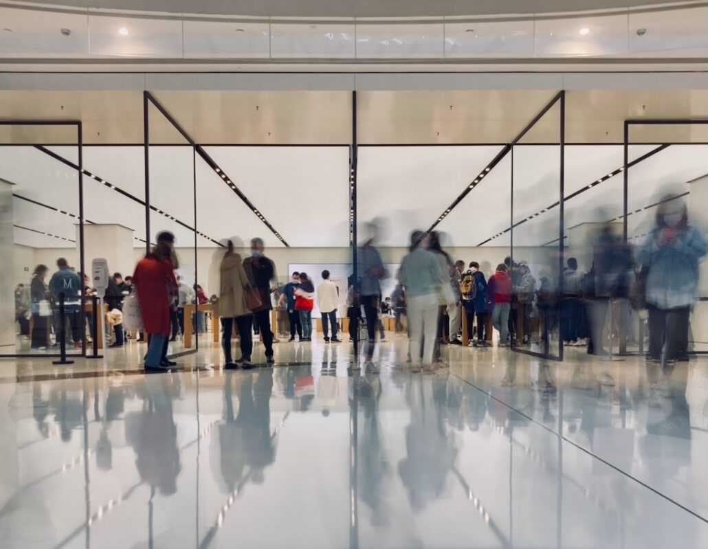 people walking on white floor tiles by airport security - impact of gun in airport charges